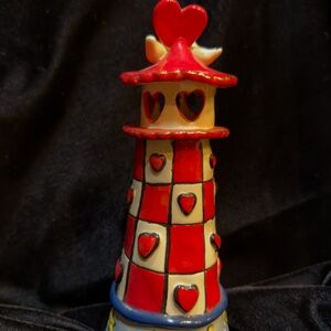 Blue Sky Signed light house 9" to is in new condition, no chips .